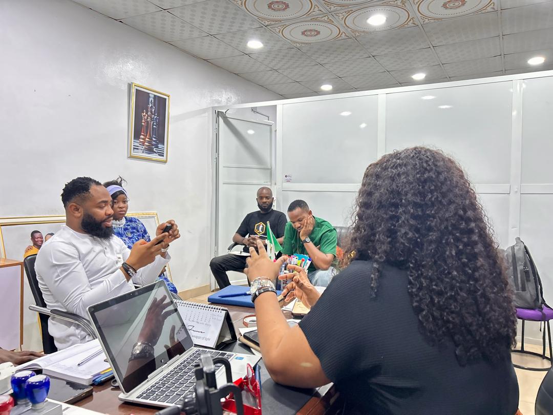 A JIT Empirical Global Consult team holding a working meeting in their office.
